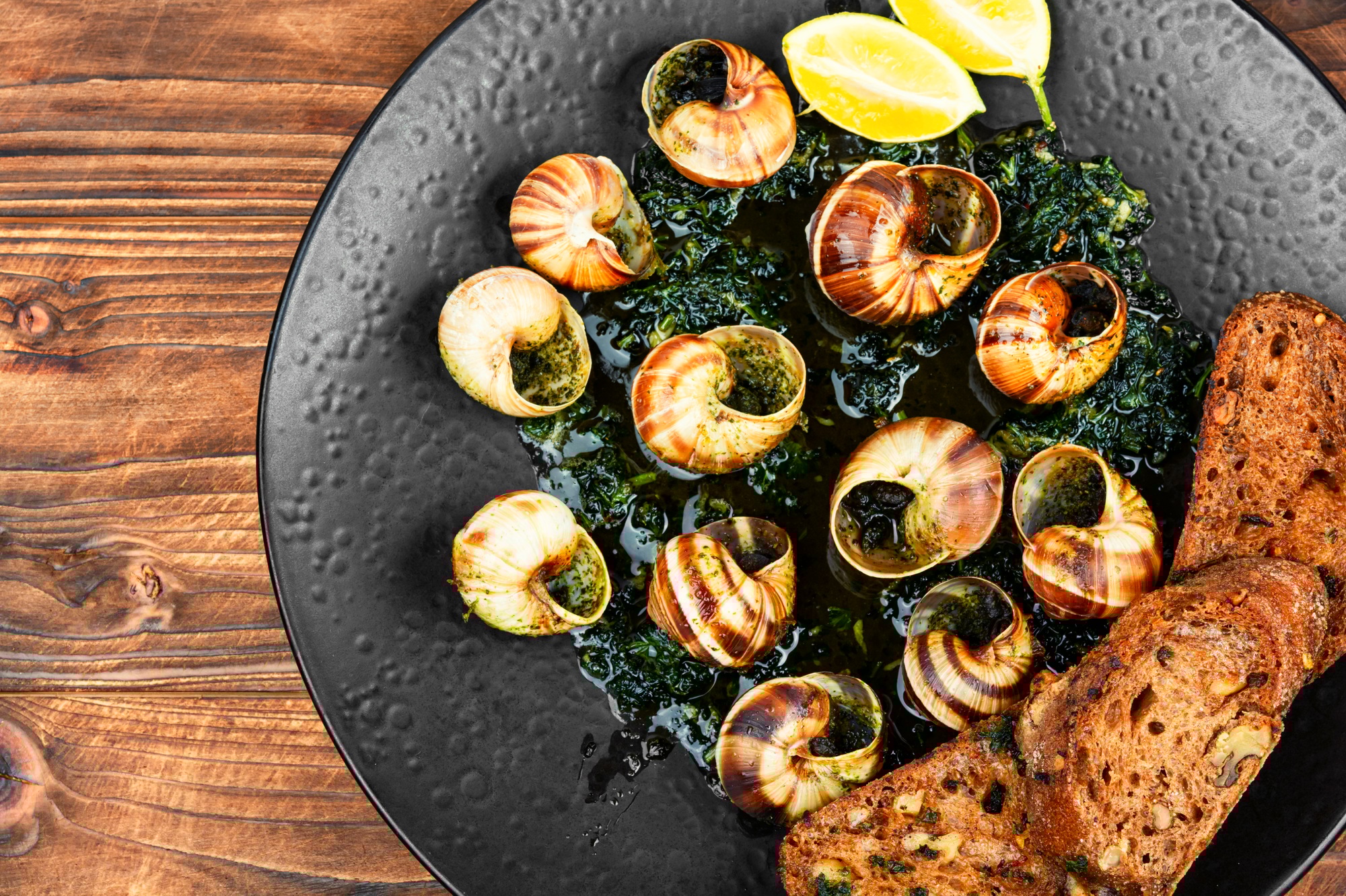 Dish of snails in spicy sauce, Spanish food - Barcelona Food Tour | Play Tour Barcelona